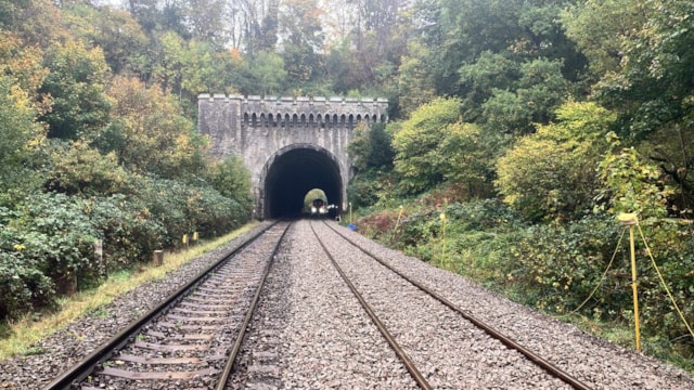 Fresh stone and new rail with tamper, St Anne's tunnel: Fresh stone and new rail with tamper, St Anne's tunnel