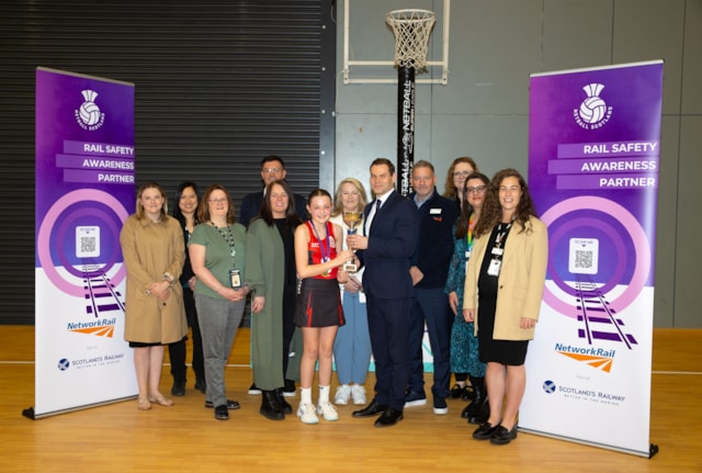 21040760: GLASGOW, SCOTLAND - APRIL 19: Ross Moran presents the winner's trophy as Network Rail announce a three-year partnership with Netball Scotland at the Emirates Arena, on April 19, 2024, in Glasgow, Scotland.