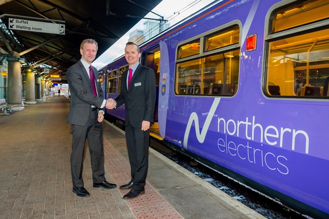 Martin Jurkowski and Rob Warnes with the first electric train to operate between Liverpool Lime Street station and Manchester Airport station