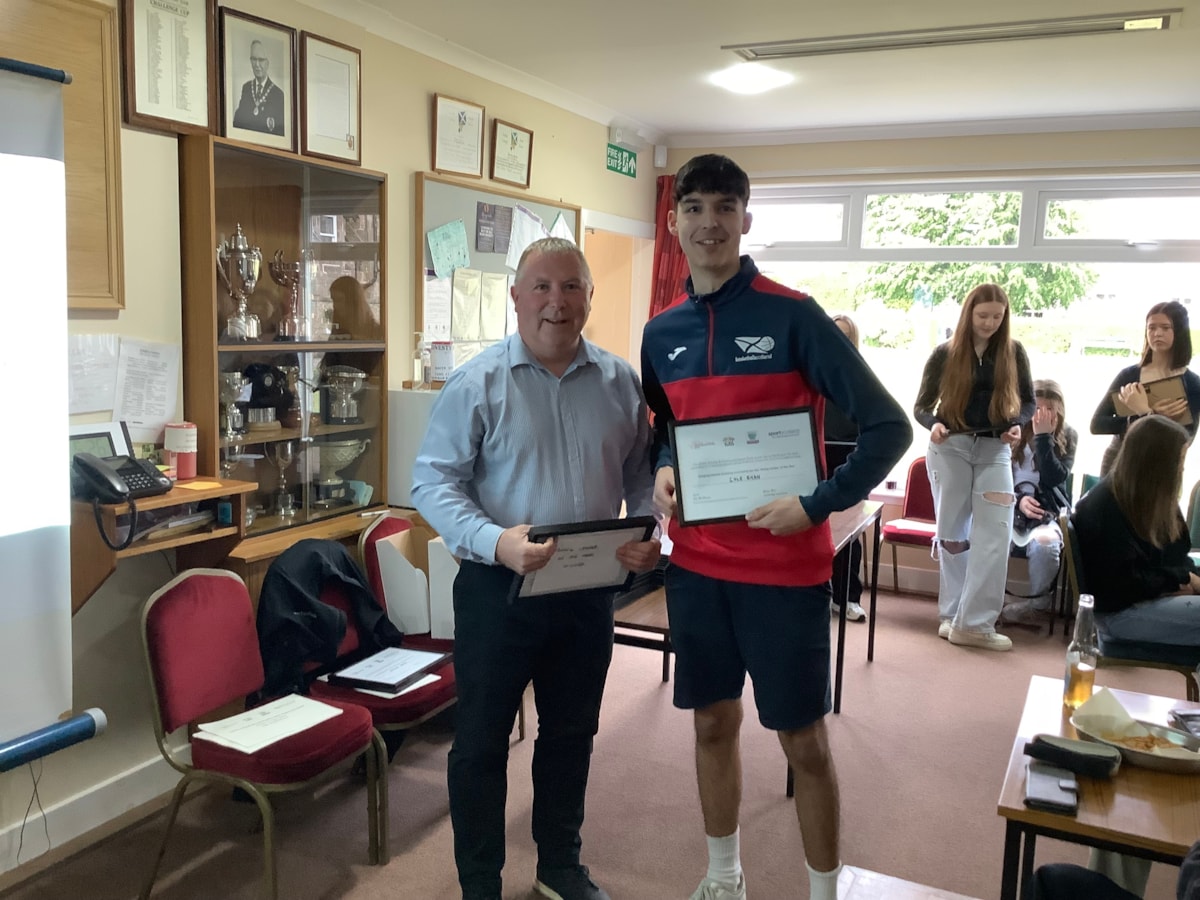 Garry Reid, lead manager at Sportscotland, with one of the award winners, Cole Ryan, at the event