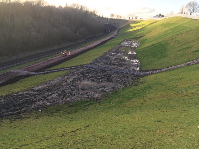Landslip repairs with grass verges growing beside Chiltern main line - March 2021