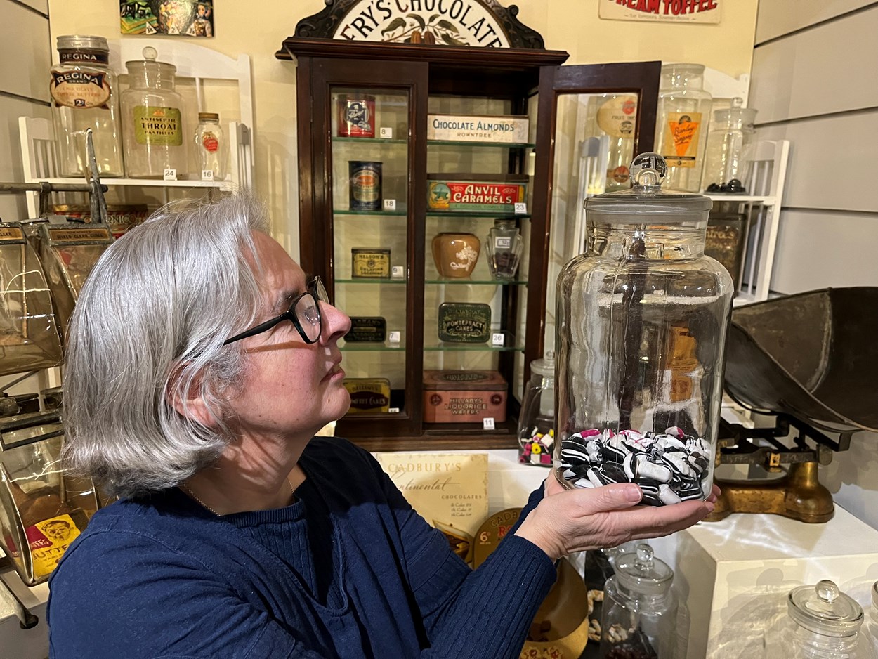 The Power of Persuasion: Kitty Ross, Leeds Museums and Galleries' curator of social history, with some of the vintage confectionery on display as part of The Power of Persuasion at Abbey House Museum.