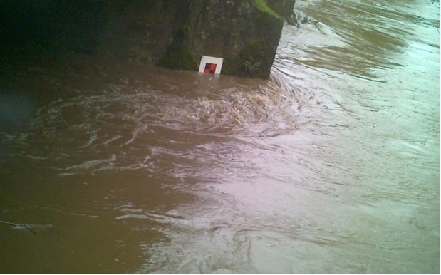 Image showing flooding reaching the closure marker on the Barnstaple-Crediton line: Image showing flooding reaching the closure marker on the Barnstaple-Crediton line