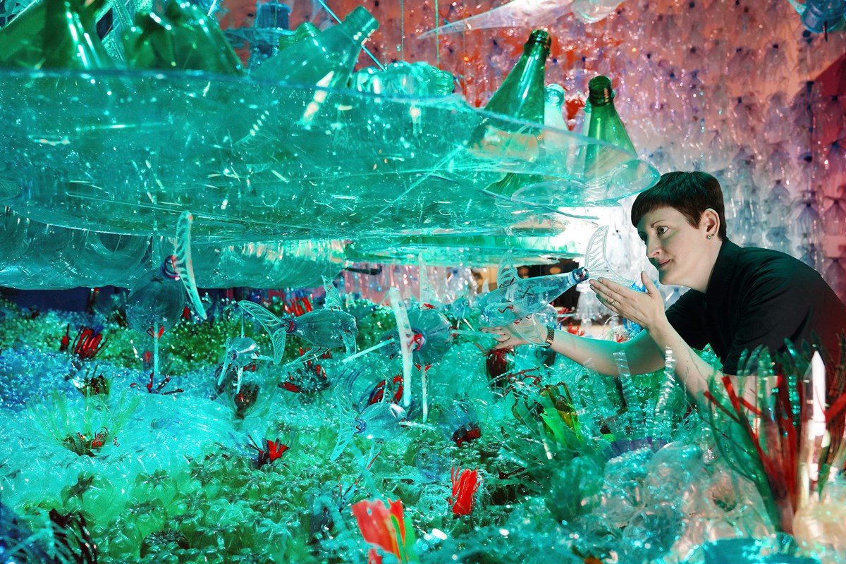 Curator Dr Ali Clark with the Bottled Ocean 2123 installation by George Nuku, part of a new exhibition, Rising Tide: Art and Environment in Oceania which opens Saturday 12 August at the National Museum of Scotland (credit Stewart Attwood)