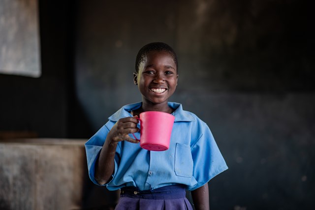 Bertha, 11, enjoys Mary’s Meals at school in Zambia.: Bertha, 11, enjoys Mary’s Meals at school in Zambia.