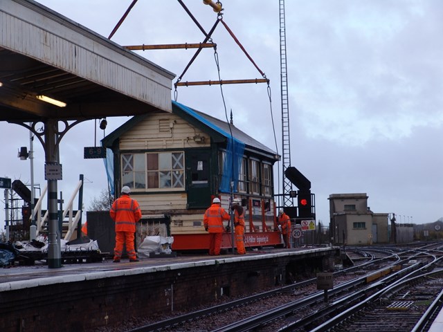 Barnham Signal Box Preparation: The specialist team prepares Barnham signal box to be lifted onto a low-loader.