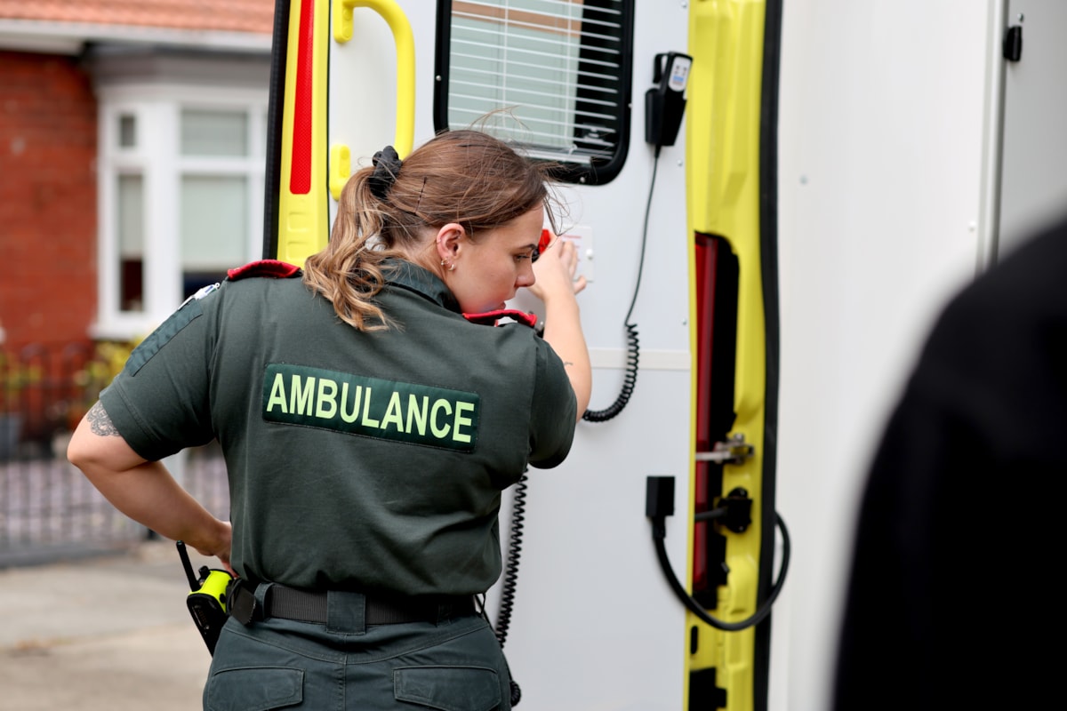 Paramedic closing ambulance door