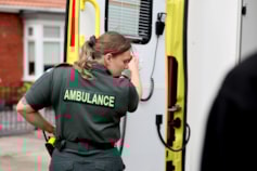 Paramedic closing ambulance door