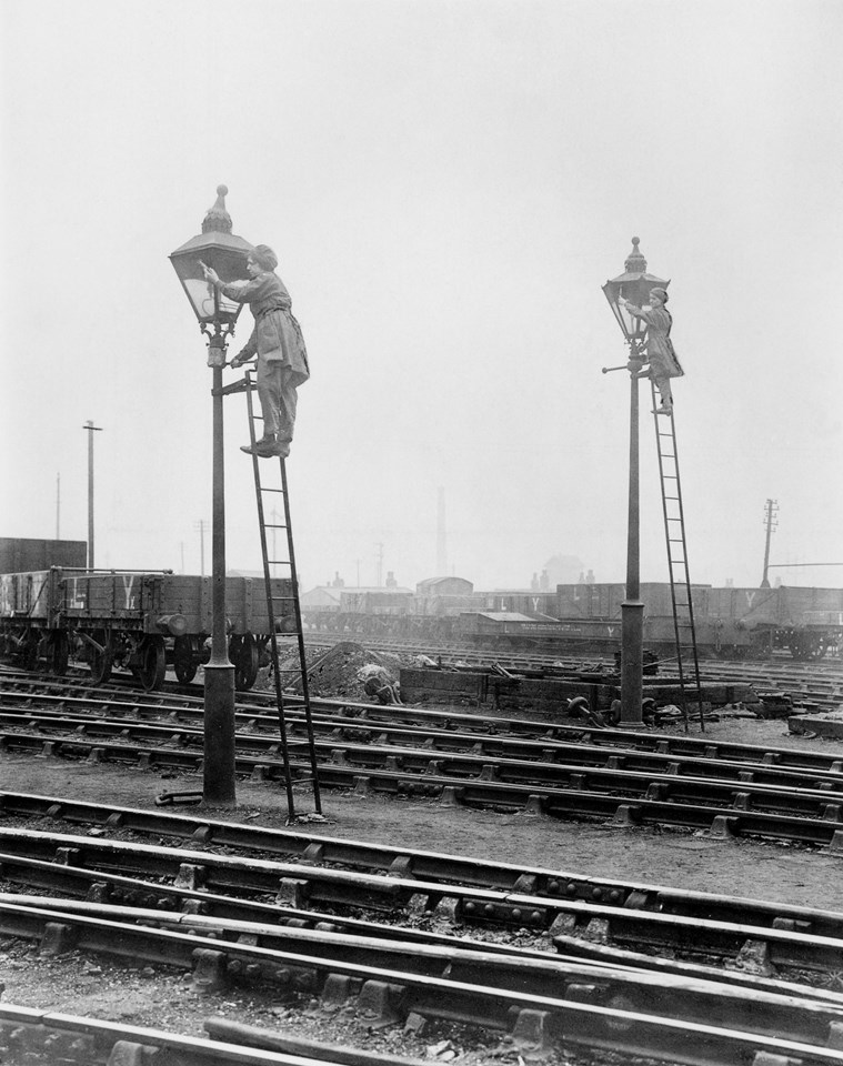 WWI exhibition Cleaning rail gas lamps: Credit: The National Railway Museum