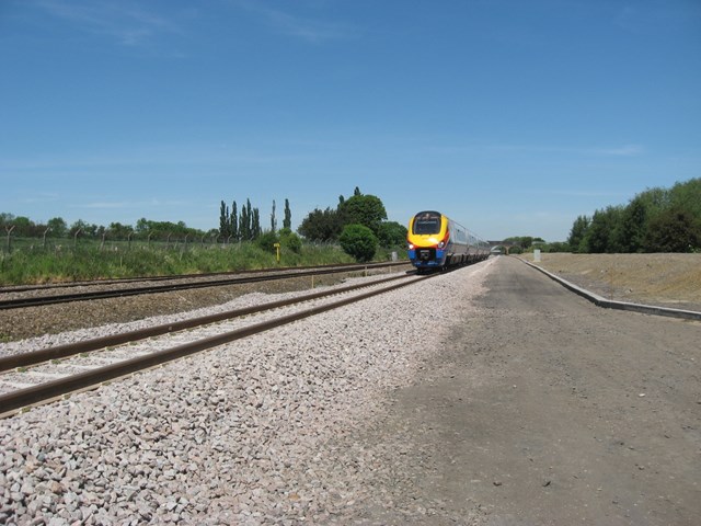 Train running along new 3rd line between Kettering and Harrowden junctions