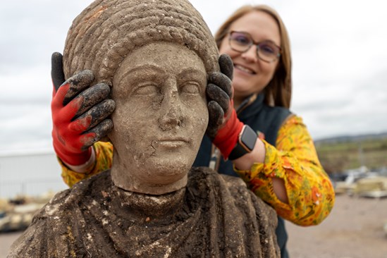 First chance to see incredible Roman busts uncovered in HS2 archaeological dig at the Discover Bucks Museum: Lead Archaeologist Dr Rachel Wood with a Roman statue