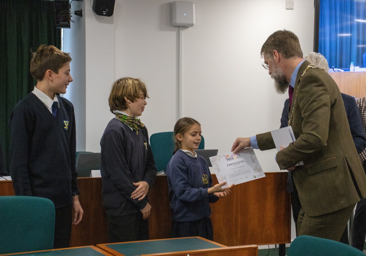 Forbes siblings receiving their certificates