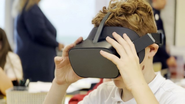 School child wearing VR headset