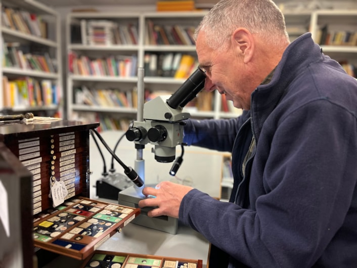 Microscope slides: Volunteer Stephen Crabtree uses a microscope to study the slides at the Leeds Discovery Centre.
Stored in small, wooden trays, the collection is thousands strong and is being painstakingly reviewed as part of a volunteer project.