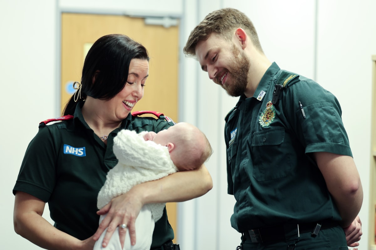 Paramedic Lynsey Bancroft and ambulance support practitioner Tom Little with baby Sebastian