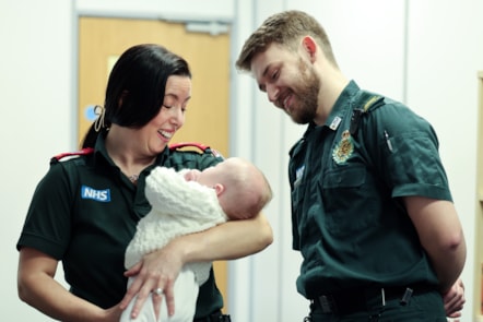 Paramedic Lynsey Bancroft and ambulance support practitioner Tom Little with baby Sebastian