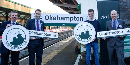 SWNS OKEHAMPTON STATION 13a: Unveiling of the new Dartmoor Line logo, left to right, Network Rail Senior Sponsor, Kevin Miller, GWR Head of Strategic Service Development, Matt Barnes, competition winner Tom Watts, and Michael Parker-Bray, of the Devon and Cornwall Rail Partnership