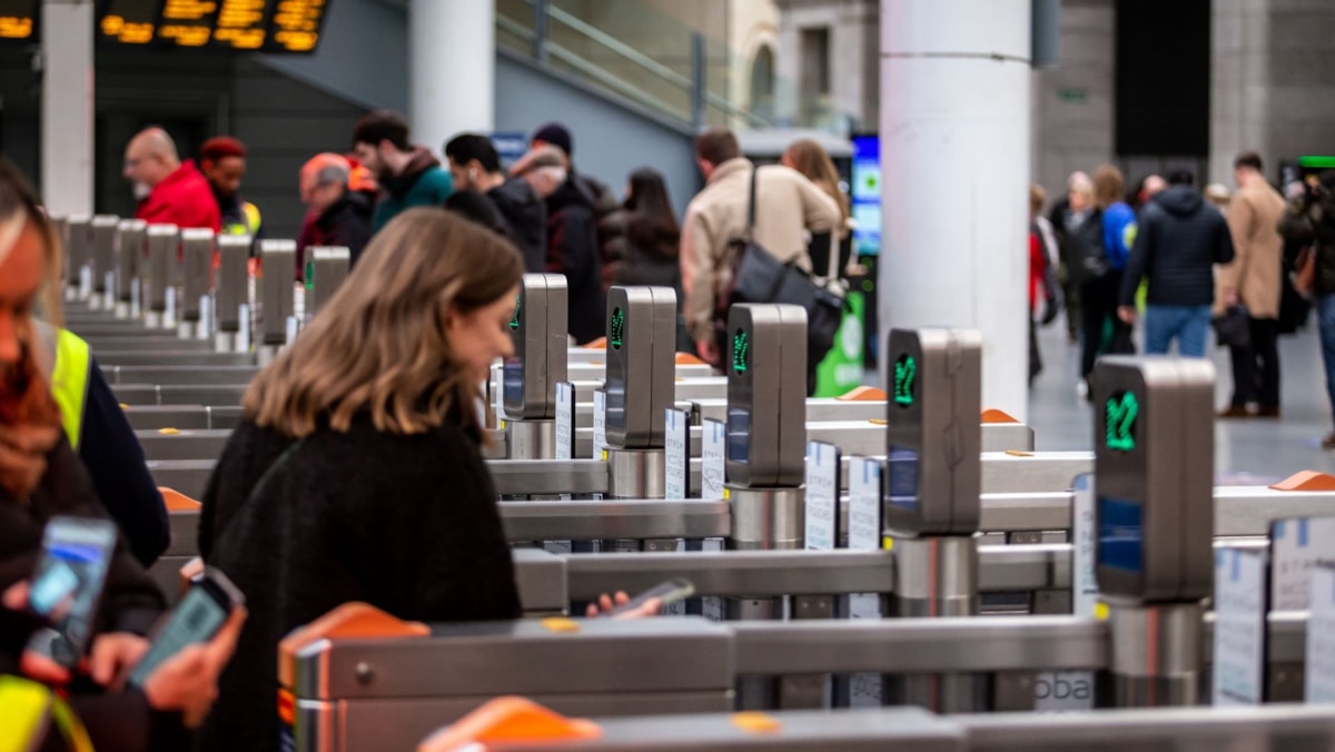 Image shows customer at ticket gateline cropped