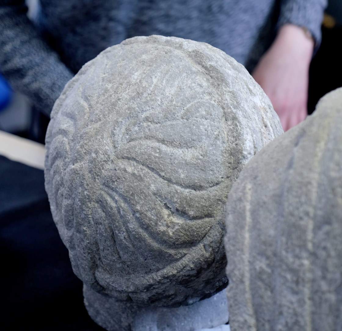 Back of cleaned female roman bust head: Since the discovery of a set of three Roman busts at the site of the old St Mary’s Church in Stoke Mandeville, Buckinghamshire, initial conservation has been completed by L-P Archaeology, working for HS2’s Enabling Works Contractor Fusion JV. As the back of the head on the female statue was encrusted with a thick layer of soil when excavated, the cleaning process has revealed how the hairstyle has been put together.
Tags: Archaeology, Buckinghamshire, Conservation, Roman