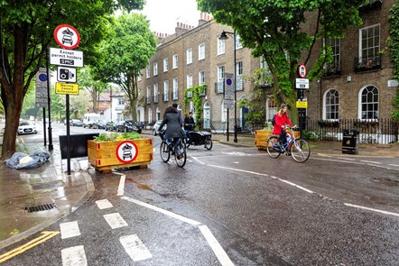 Bikes and cargo bikes cross through a traffic filter on Halton Road, in the St Mary's Church people-friendly streets neighbourhood