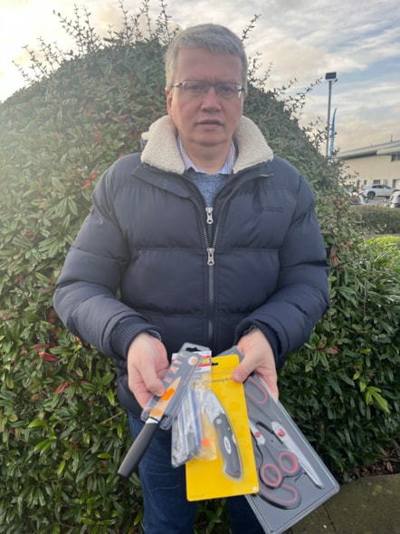 Lancashire County Councillor Michael Green, cabinet member for Health and Wellbeing, holds the illegally sold knives that were seized during Operation Sceptre