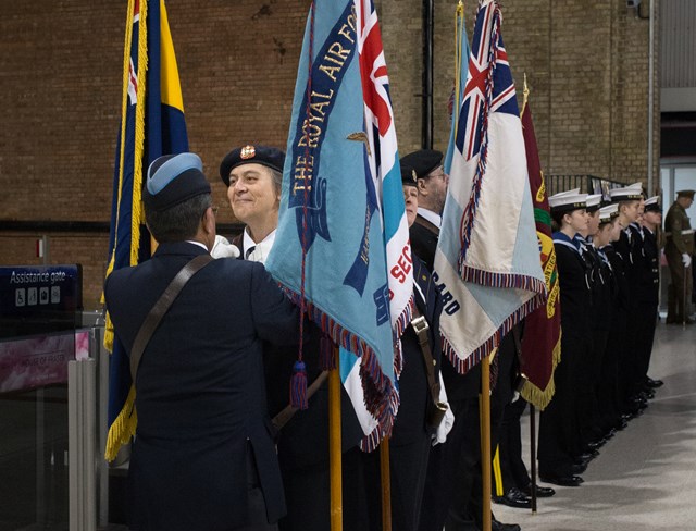 Last minute adjustments to uniforms at the service to commemorate the Unknown Warrior at Victoria station, Nov 10, 2016: A last minute adjustment to uniform at the service to commemorate the Unknown Warrior at Victoria station, Nov 10, 2016