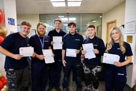 apprentices at Merthyr college receiving results 