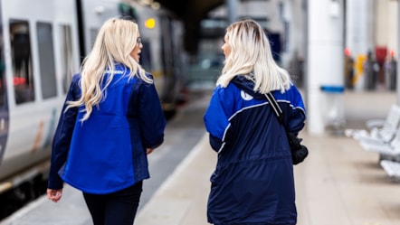 This image shows two female Northern staff members at a station