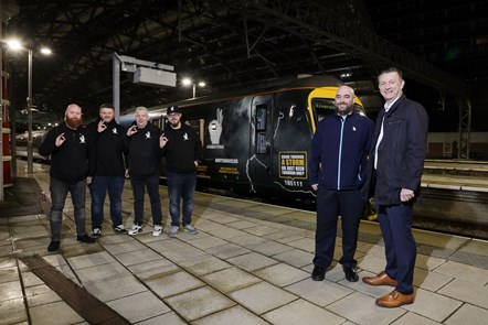 (L-R) Andrew Murray, Lucas Whitehead, Dennis Keogh, Luke Tetlow-Cross, Chris Nutton (TPE Major Projects Director) and Ian Watson (TPE Driver) with the new Andy's Man Club TPE Train