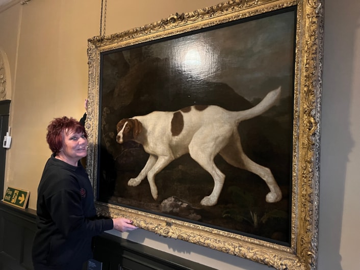 Pet portrait: Visitor assistant Deborah Crossley with the beautiful oil painting of Lord Clermont’s faithful canine companion, which has gone on display to visitors for the first time in a number of years, following a loan spell at Wentworth Woodhouse in Rotherham.

Painted by celebrated artist George Stubbs in 1772, the portrait of Phillis was commissioned by her owner William Henry Fortescue, Lord Clermont, a keen sportsman who kept a sizeable kennel, but who was known to be particularly fond of Phillis.