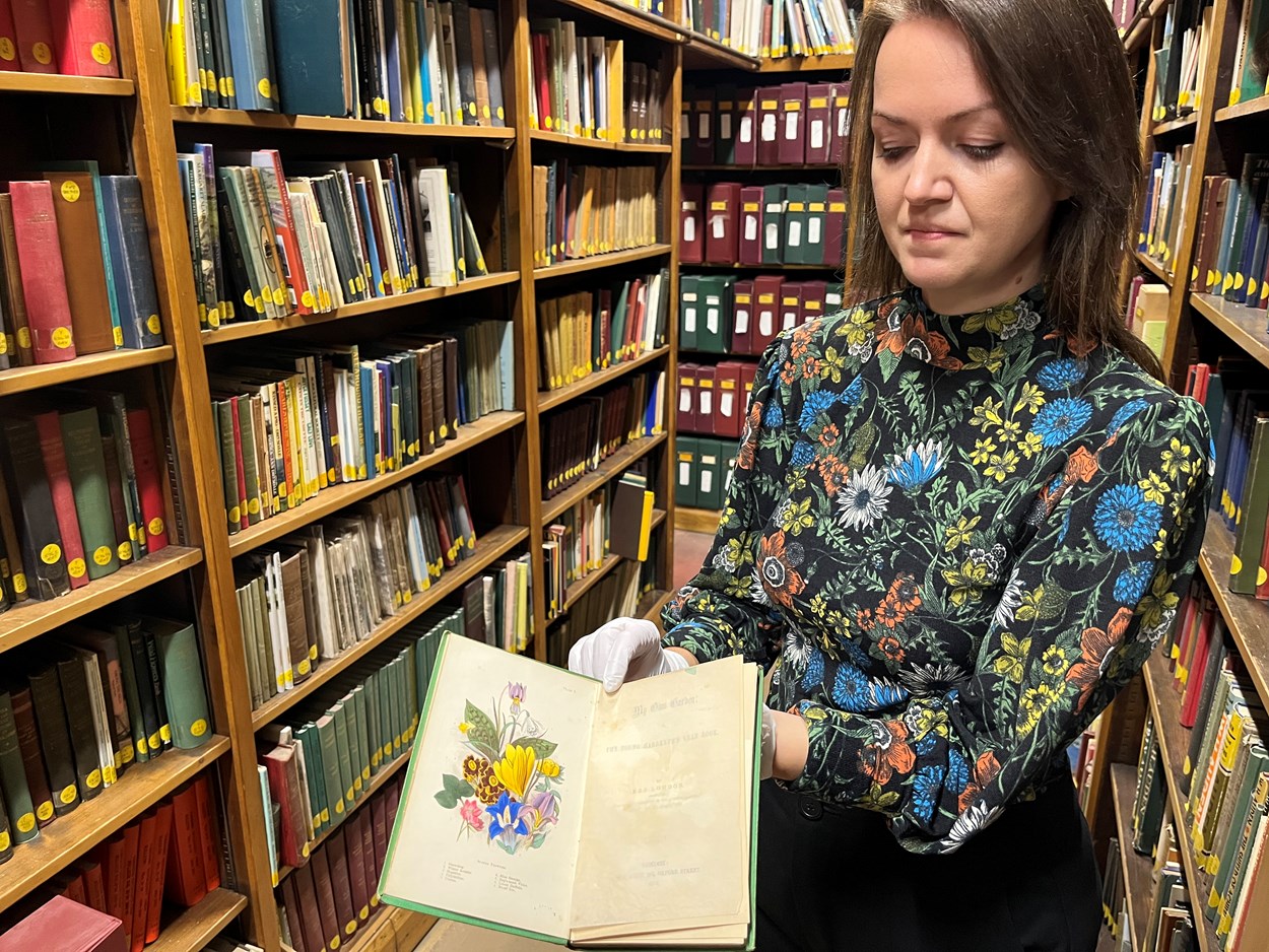 Leeds Central Library's poisonous book: Rhian Isaac, Leeds Central Library's senior librarian with the library's copy of My Own Garden: The Young Gardener’s Yearbook. Published back in 1855, it has been safely tucked away behind the scenes at Leeds Central Library, well away from visitors.
Recent research carried out by experts at the library revealed that the seemingly unassuming book most likely owes its vivid, emerald, green colour to a dye containing quantities of arsenic, which can be lethal when ingested.