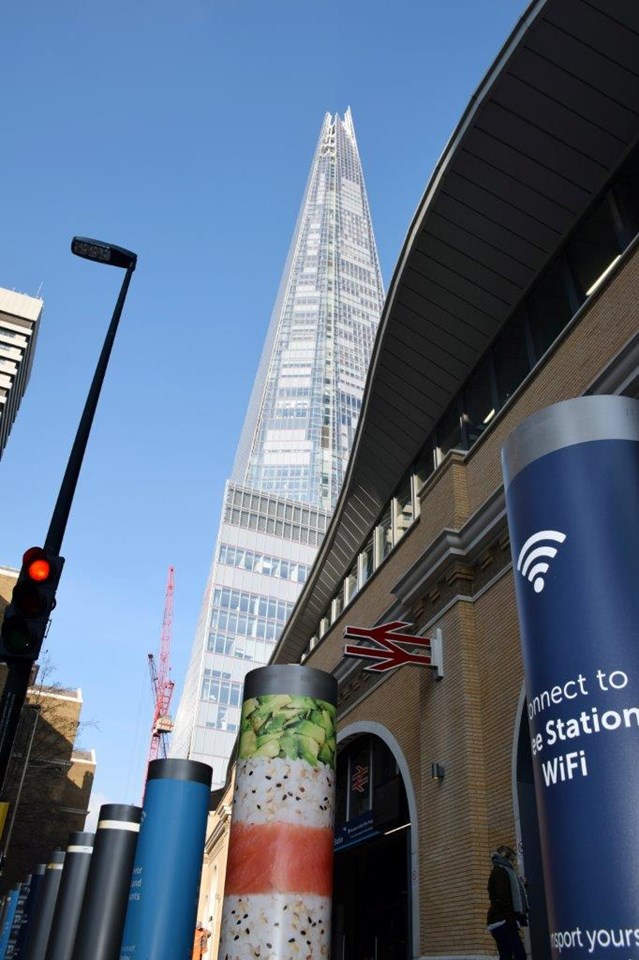 London Bridge station with Shard in distance and wifi poster