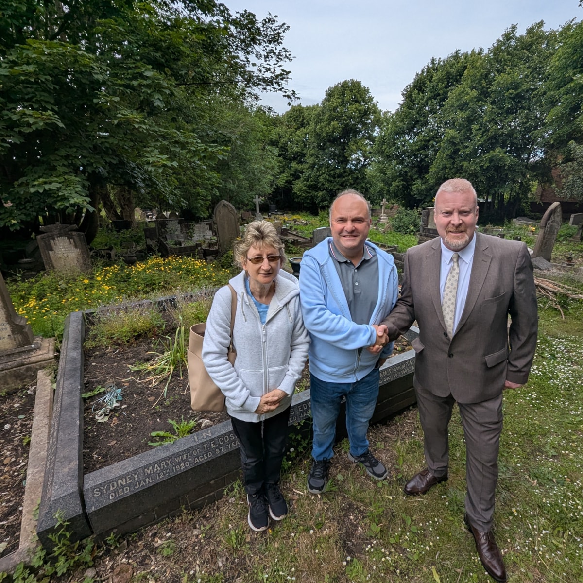 Cllr Damian Corfield at All Saints Graveyard with Paul & Diane Rhodes of the Friends group