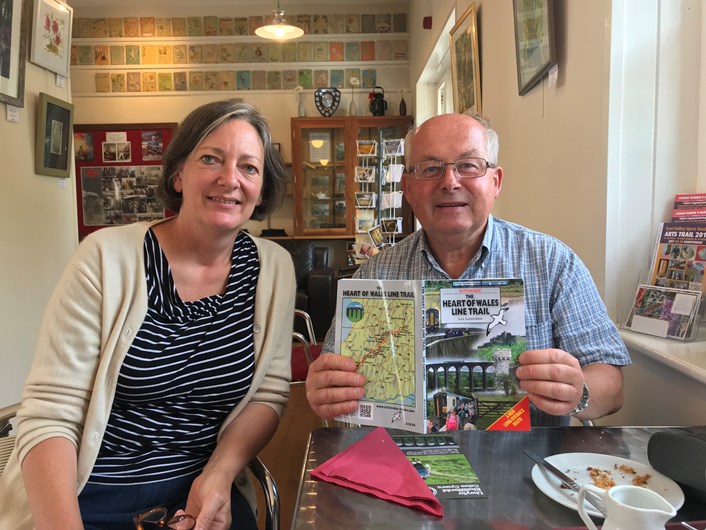 Lisa Dennison, Development Officer at the Heart of Wales Community Rail Partnership pictured with a visitor to the area who recently purchased the walking trail book