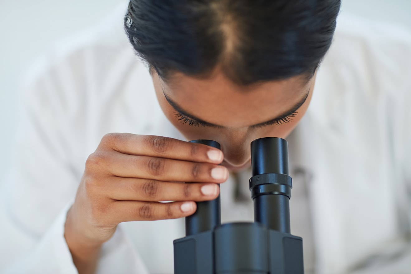 female-scientist-looking-through-a-microscope-2 original