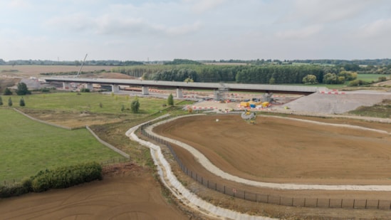 View of the completed Westbury viaduct with a balancing pond being constructed in the foreground Oct 2026