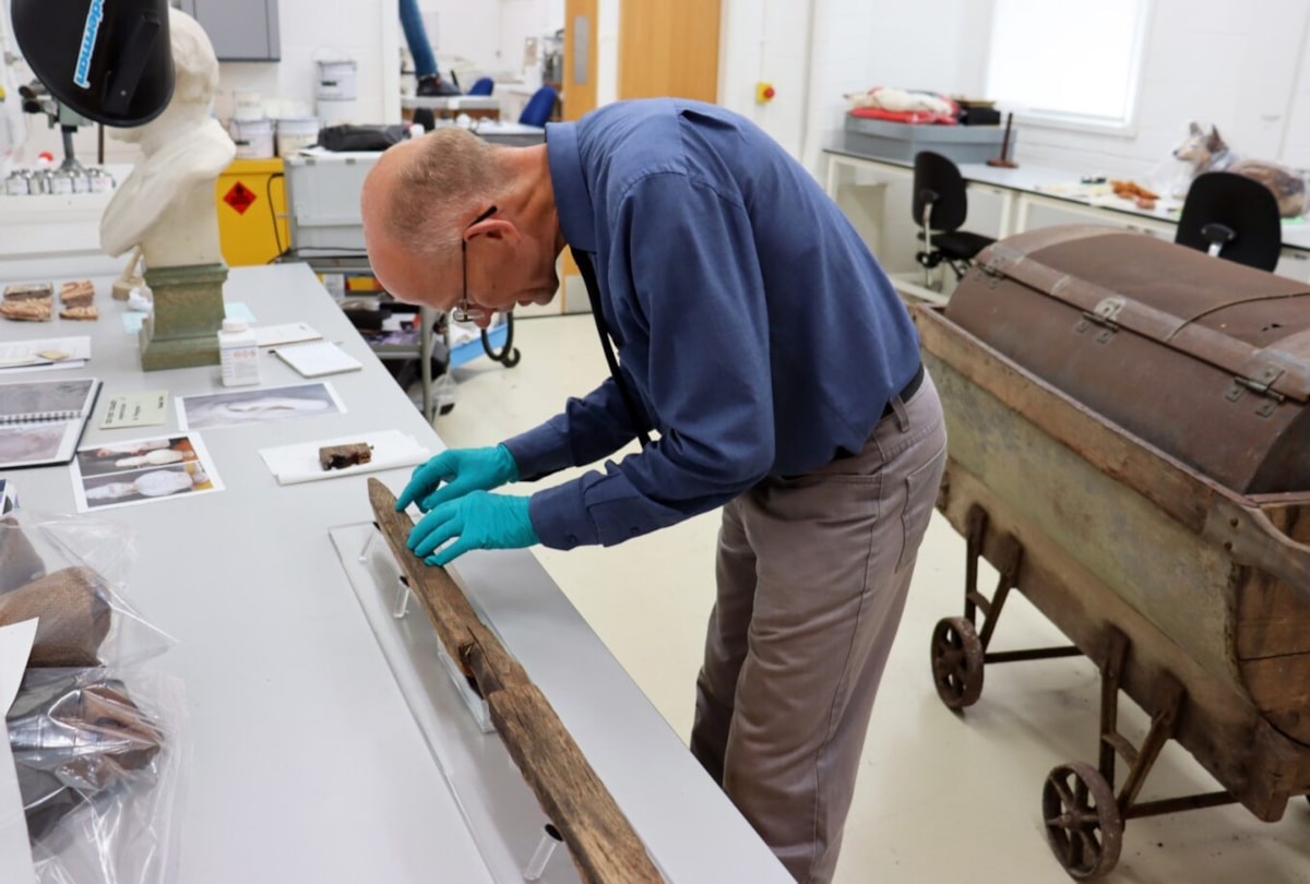 Curator Philip Butler working with Roman pilum-2