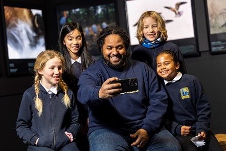Wildlife cameraman and presenter Hamza Yassin met children from Edinburgh's Bun Sgoil Taobh Na Pairce (Parkside Primary School) at the opening of the new exhibition, Wildlife Photographer of the Year, which opens on Saturday 20 January at the National Museum of Scotland. Image © Duncan McGlynn-6