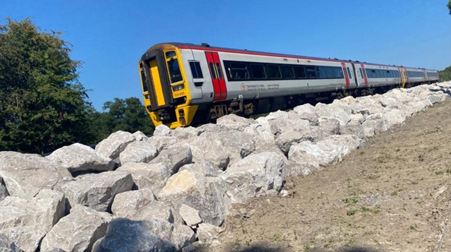 Weathering the storm: flood devastated stretch of mid-Wales railway more resilient than ever with new 10,000 tonne ‘rock armour’ defence: TfW train (header photo) on Cambrian Line Cambrian line 120822 resized