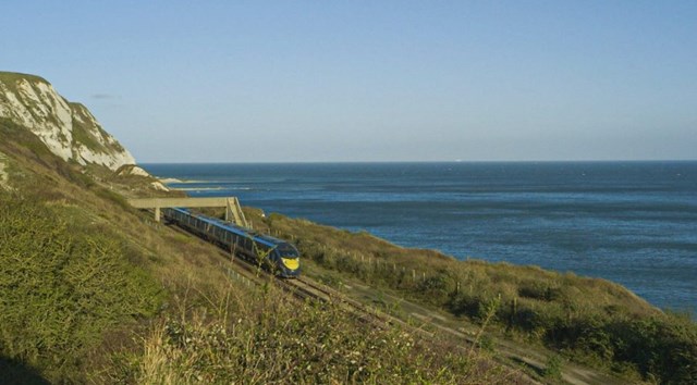 Network Rail joins leading railway organisations from across the globe in further commitment to tackling climate change: NR- train at Dawlish