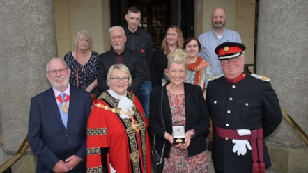 Rachel Body, wife of Alderman Richard Body accepts his posthumous award alongside his family, with the Mayor of Dudley, consort and Deputy Lieutenant