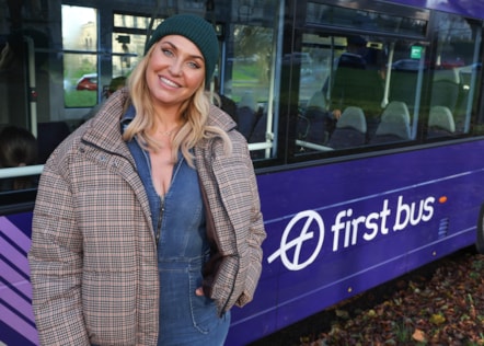 Josie Gibson outside a First Bus