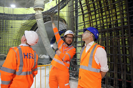 HS2 CEO, Mark Thurston, and TfL Commissioner Andy Byford, speak to Rob Williams, MDJV, about the construction of the shaft for the Traction Sub station at Euston: Tags: Euston, construction, TSS, TfL

L-R Mark Thurston, CEO, HS2 Ltd, Rob Williams, Senior Project Manager, MD JV, Andy Byford, Commissioner, Transport for London