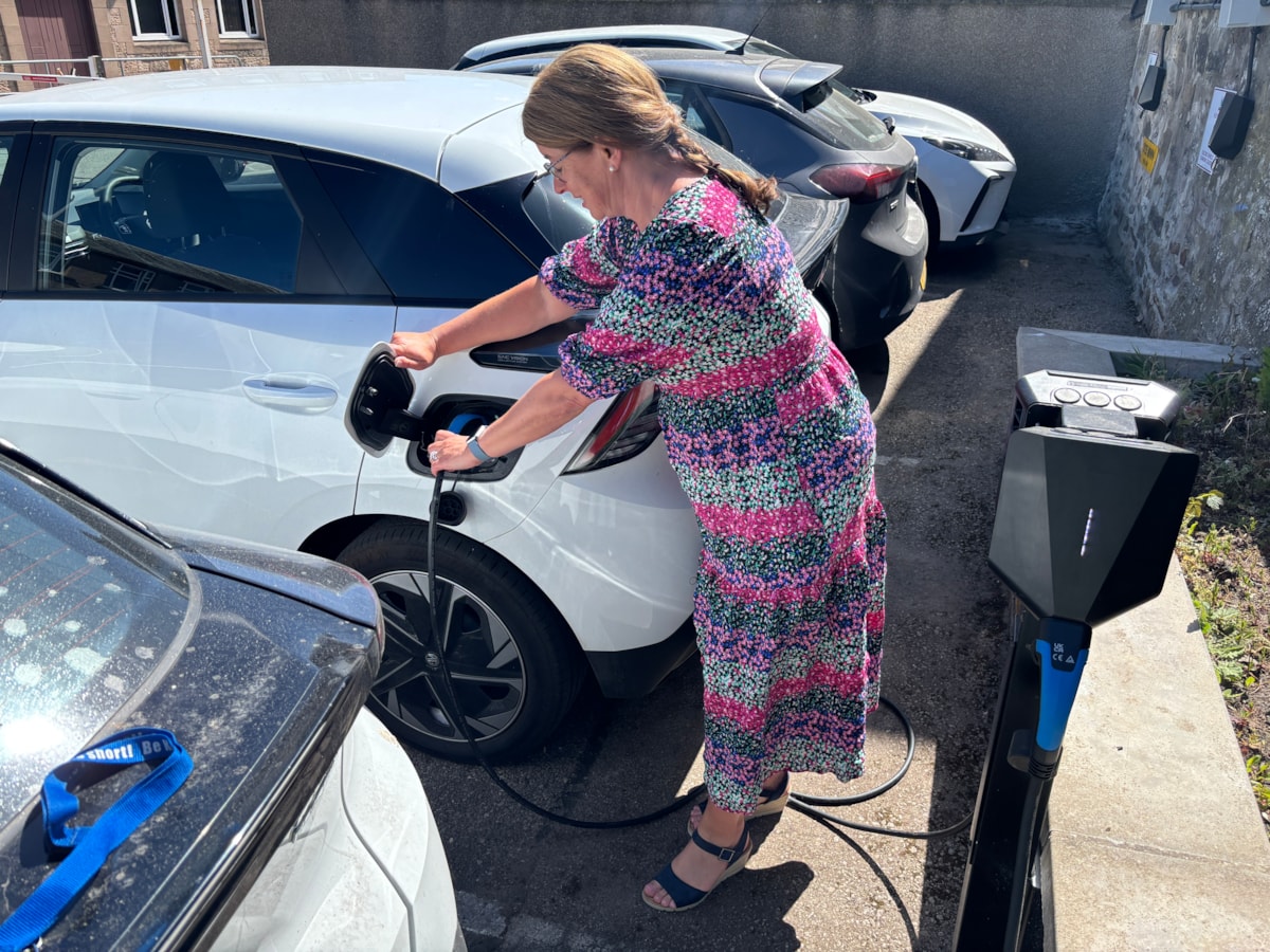 Moray Council Leader, Cllr Kathleen Robertson with EV charger extra