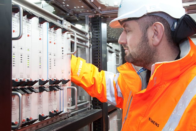 Engineer testing new signalling equipment: Engineer testing new signalling equipment