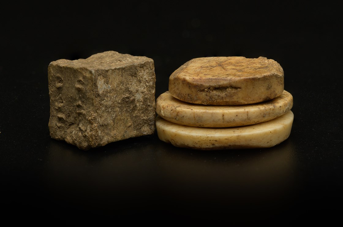 Roman (lead) die (bone) gaming pieced uncovered during the archaeology excavation at Blackgrounds, Chipping Warden, Northamptonshire