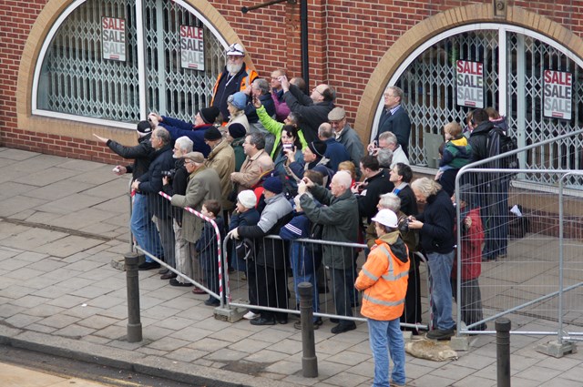 Local people watch work unfold: Local people watch work unfold