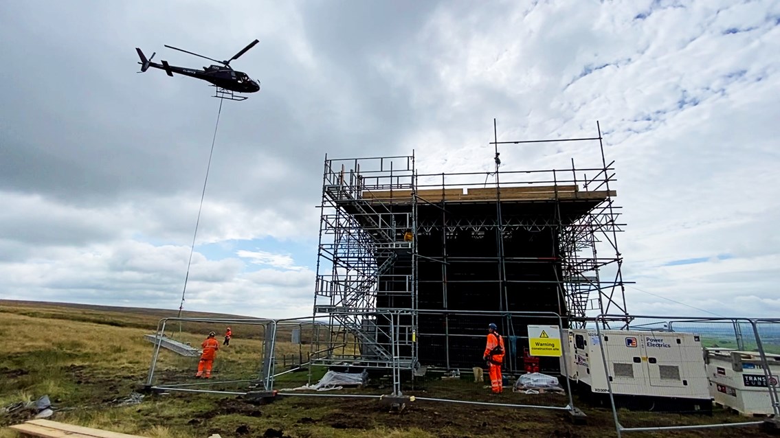 Helicopters help railway engineers going 'down under' in the Peak District: Wide shot of Cowburn Tunnel helicopter airlift