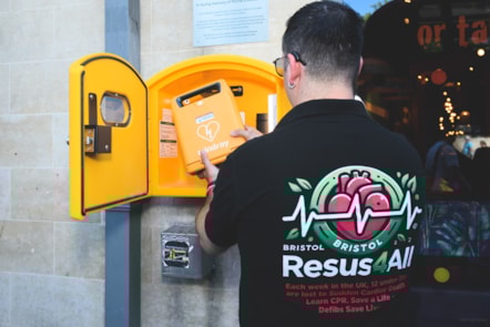 First Bus driver Carlos Santos with the defibrillator @JonCraig Photos