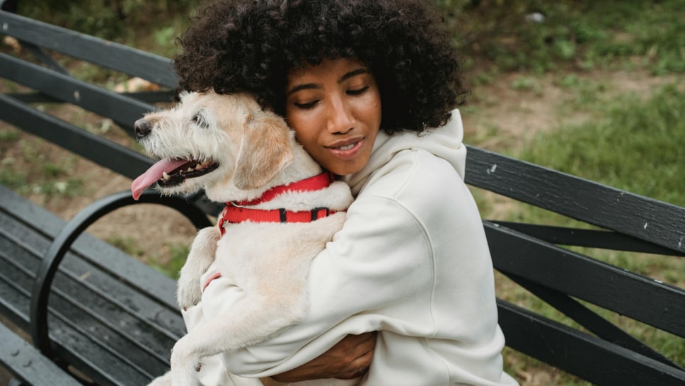 Woman hugging dog